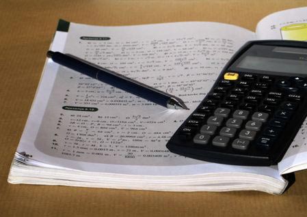 notebook, pen, and calculator
