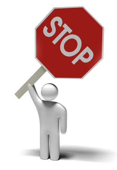 person holding a stop sign